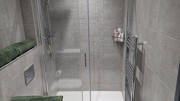 Shower, hair dryer, towels, soap