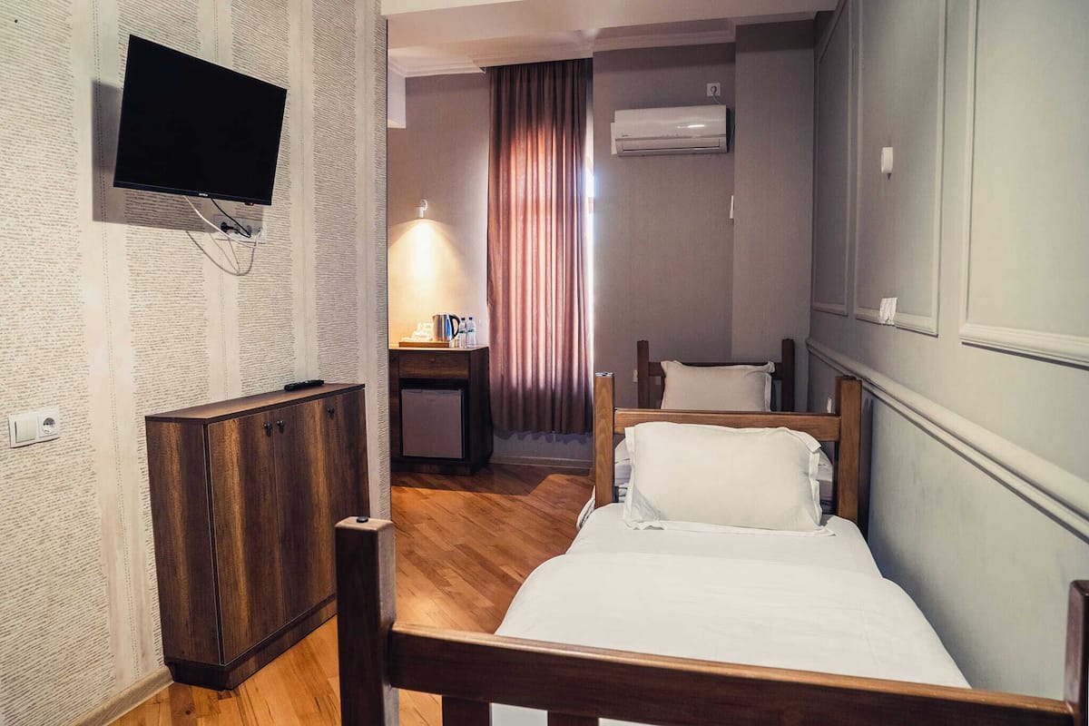 Basic Twin Room, City View | Blackout drapes, iron/ironing board, free WiFi, bed sheets