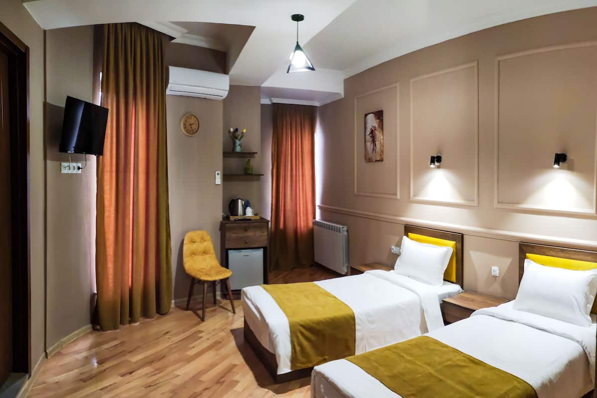 Basic Twin Room | Blackout drapes, iron/ironing board, free WiFi, bed sheets