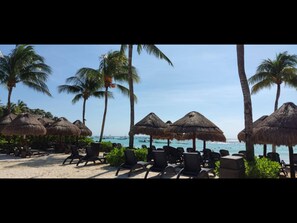 On the beach, sun loungers, beach towels