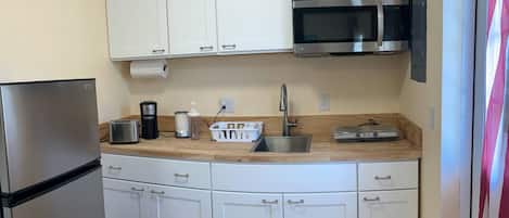 Fridge, microwave, stovetop, coffee/tea maker