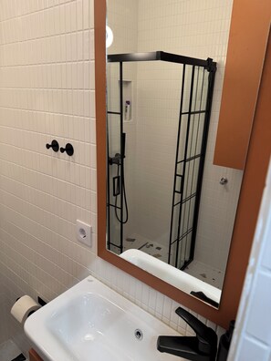 Shower, hair dryer, towels, soap