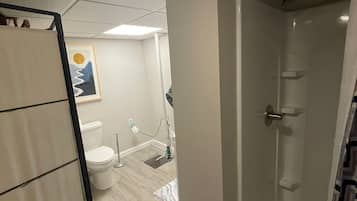 Shower, towels, soap, toilet paper