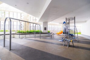 An indoor playground with swings, climbing structures, and a slide. - JB Paradigm Mall by RR JBcity (Tebrau)