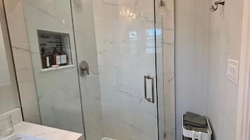 Shower, towels, soap, toilet paper