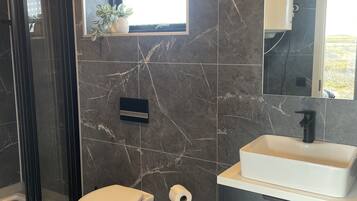 Shower, hair dryer, towels, soap