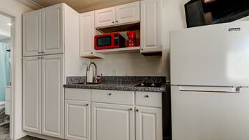 Fridge, microwave, stovetop, coffee/tea maker