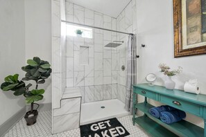 Shower, hair dryer, towels, soap