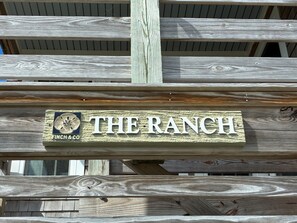 A wooden sign with "THE RANCH" and "FINCH & CO" on it.