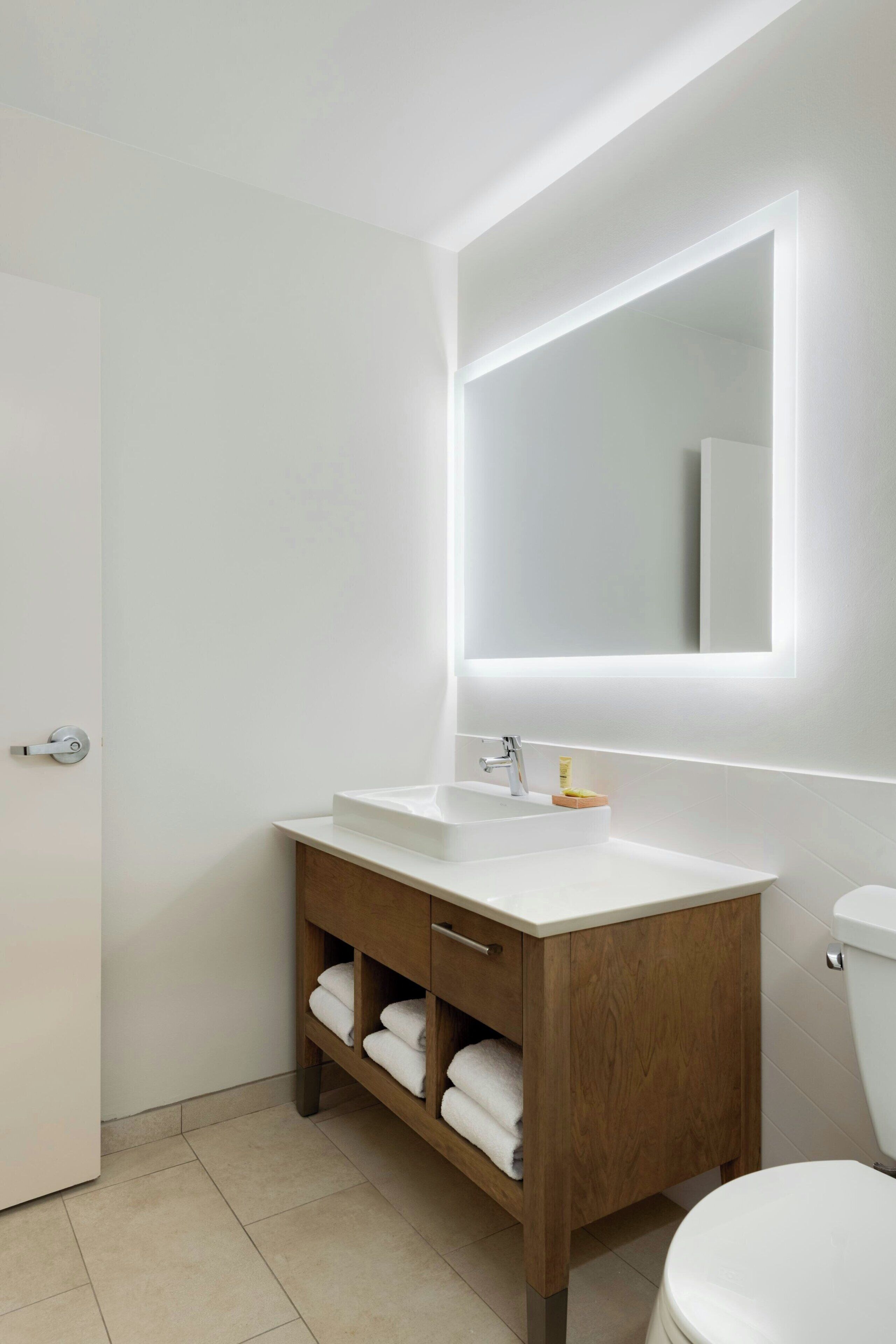 Shower, rainfall showerhead, hair dryer, towels