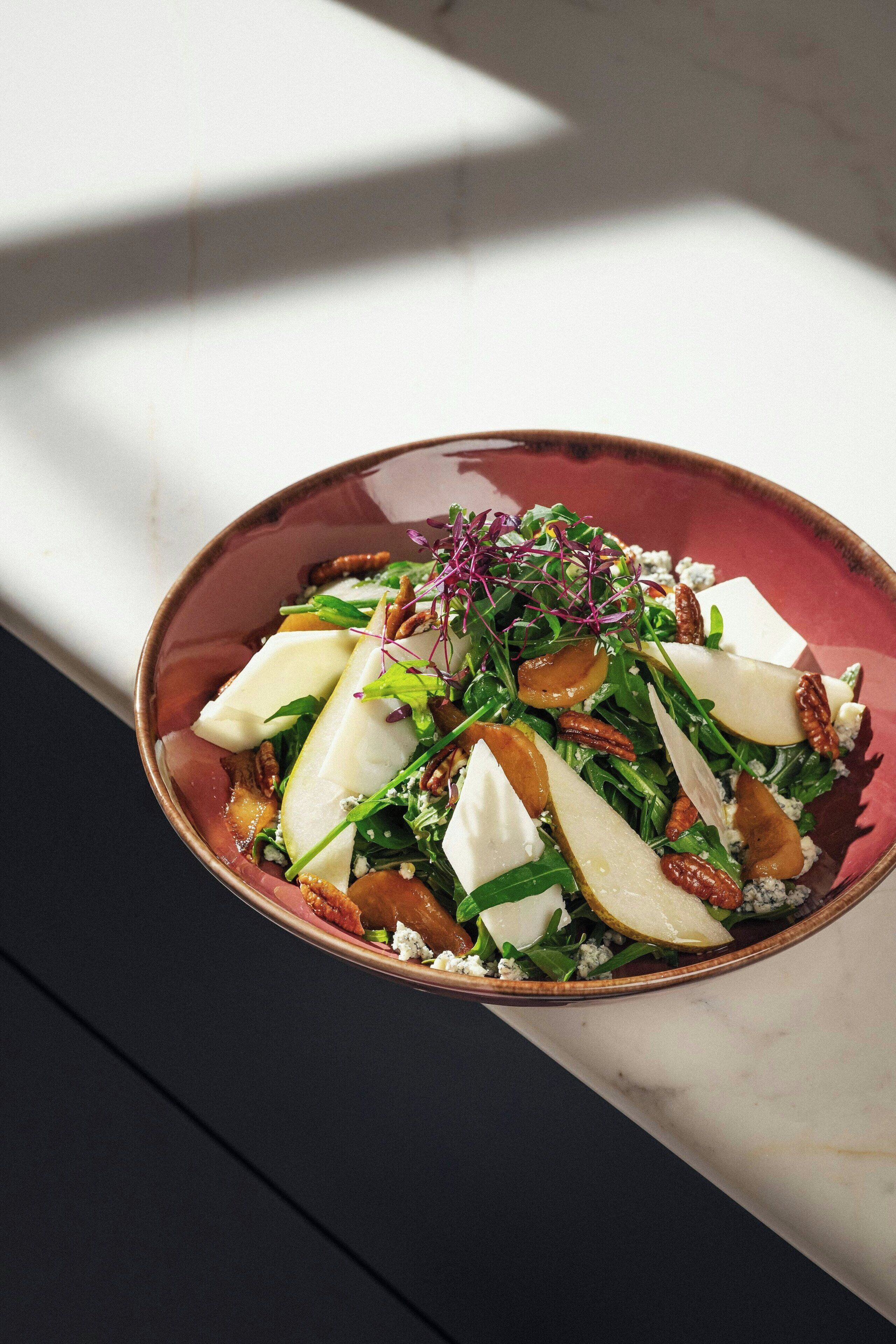 A bowl of salad with various ingredients.