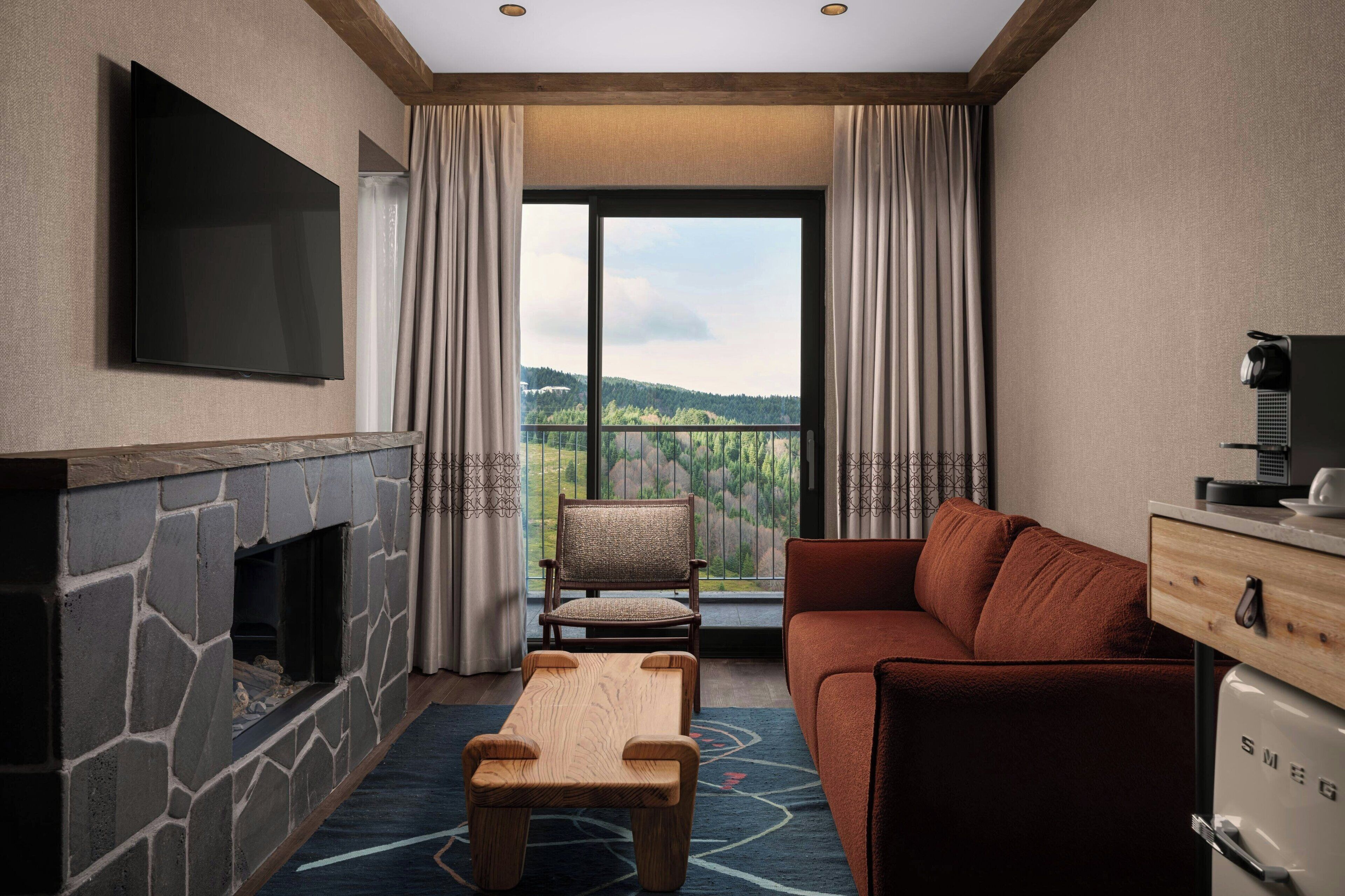 Suite, 1 King Bed with Sofa bed, Non Smoking, Mountain View (Balcony) | Minibar, in-room safe, desk, laptop workspace