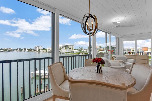 Outdoor dining - Waterfront Escape | 2BR + Den Corner Unit with Stunning Bay Views (Naples)