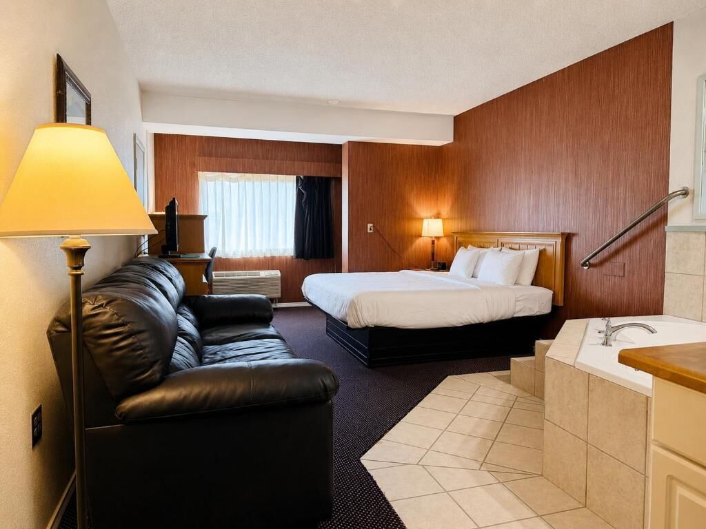Deluxe Studio Suite, Non Smoking | Desk, laptop workspace, blackout drapes, iron/ironing board