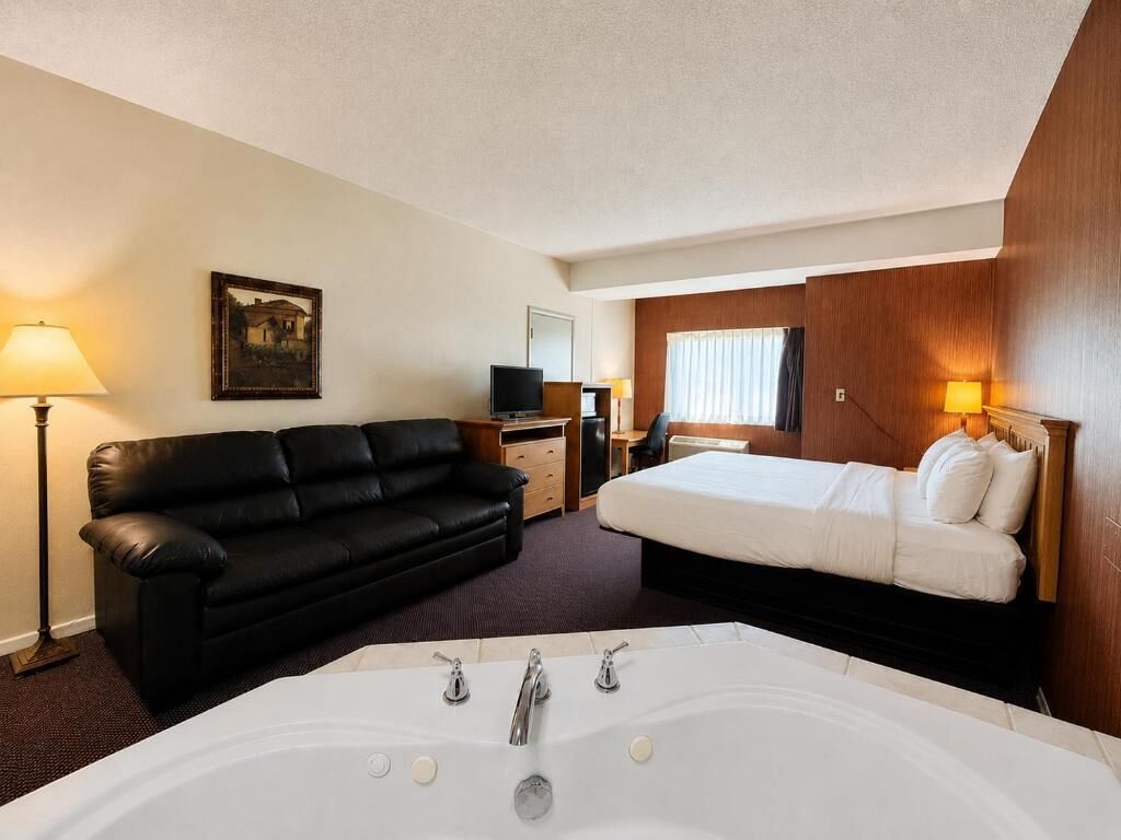 Deluxe Studio Suite, Non Smoking | Desk, laptop workspace, blackout drapes, iron/ironing board