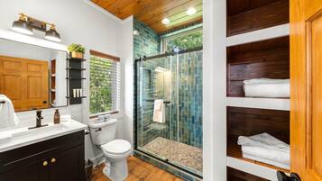 Shower, hair dryer, towels, toilet paper