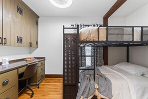 A bunk bed with a desk and chair, wooden wardrobe, and a small window. - Perfect Group Stay! See the Stunning Social Area X6 (Grandview)