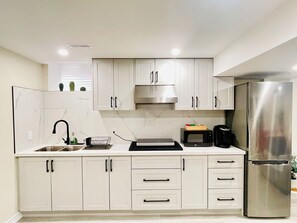 Fridge, microwave, stovetop, coffee/tea maker