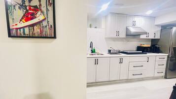 Fridge, microwave, stovetop, coffee/tea maker