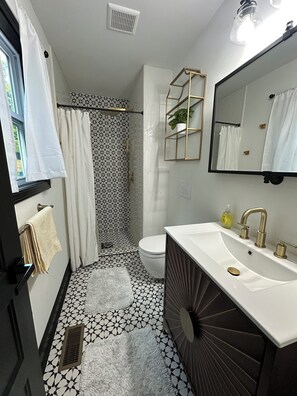 Shower, hair dryer, towels, soap