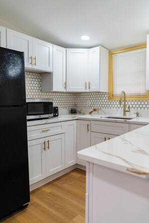 Fridge, microwave, stovetop, coffee/tea maker