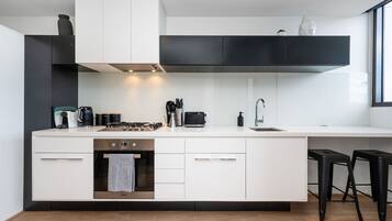 Fridge, stovetop, dishwasher, coffee/tea maker