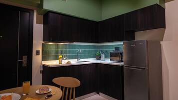 Deluxe Apartment, 1 Queen Bed with Sofa bed, Balcony, City View | Private kitchen | Fridge, microwave