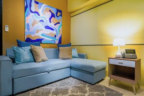 Deluxe Apartment, 1 Queen Bed with Sofa bed, Balcony, City View | Living area - Aeon Towers  (Davao)