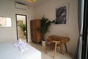Luxury Suite, Courtyard View | Desk, laptop workspace, iron/ironing board, free WiFi
