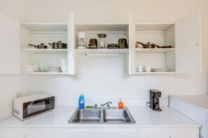 Fridge, microwave, stovetop, coffee/tea maker