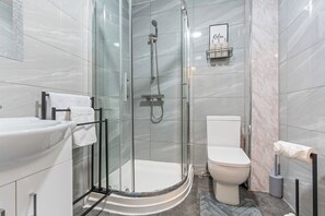 Shower, hair dryer, towels, soap