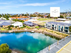 A residential area with houses, a dock, and a clear sky. - Waterside Victor Harbor (Victor Harbor)