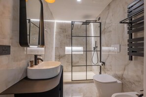 Shower, free toiletries, hair dryer, slippers