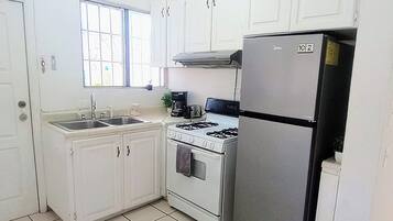 Fridge, microwave, stovetop, coffee/tea maker