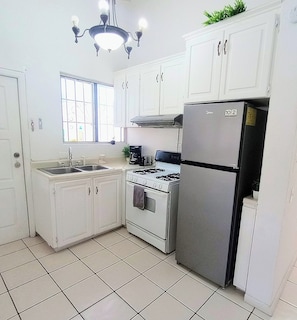 Fridge, microwave, stovetop, coffee/tea maker