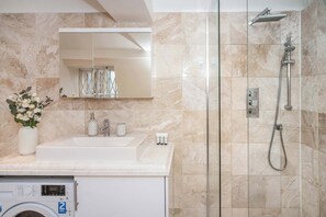 Shower, hair dryer, towels