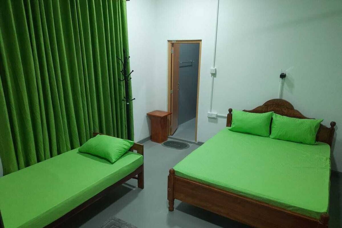 Deluxe Triple Room | Desk, laptop workspace, iron/ironing board