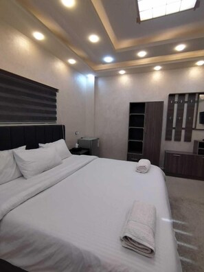 Comfort Triple Room, City View | Blackout drapes, soundproofing, iron/ironing board