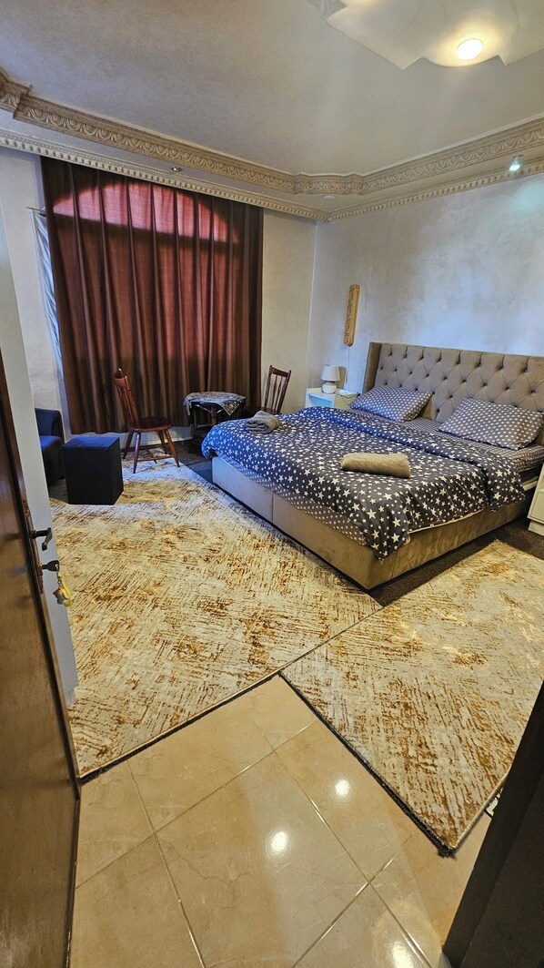 Double Room, City View | Blackout drapes, soundproofing, iron/ironing board