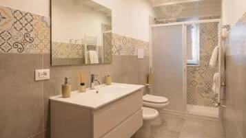 Classic Apartment, Balcony, City View | Bathroom | Shower, hair dryer, towels, soap