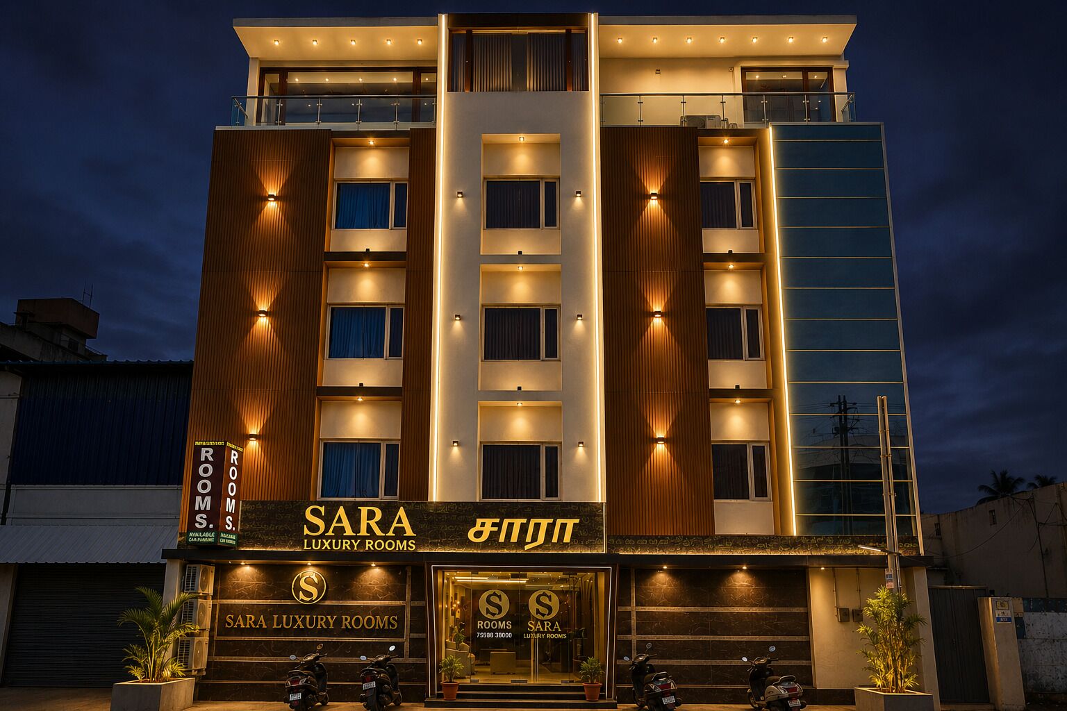 A multi-story hotel with a prominent sign for 'SARA LUXURY ROOMS' and a modern facade with illuminated windows.