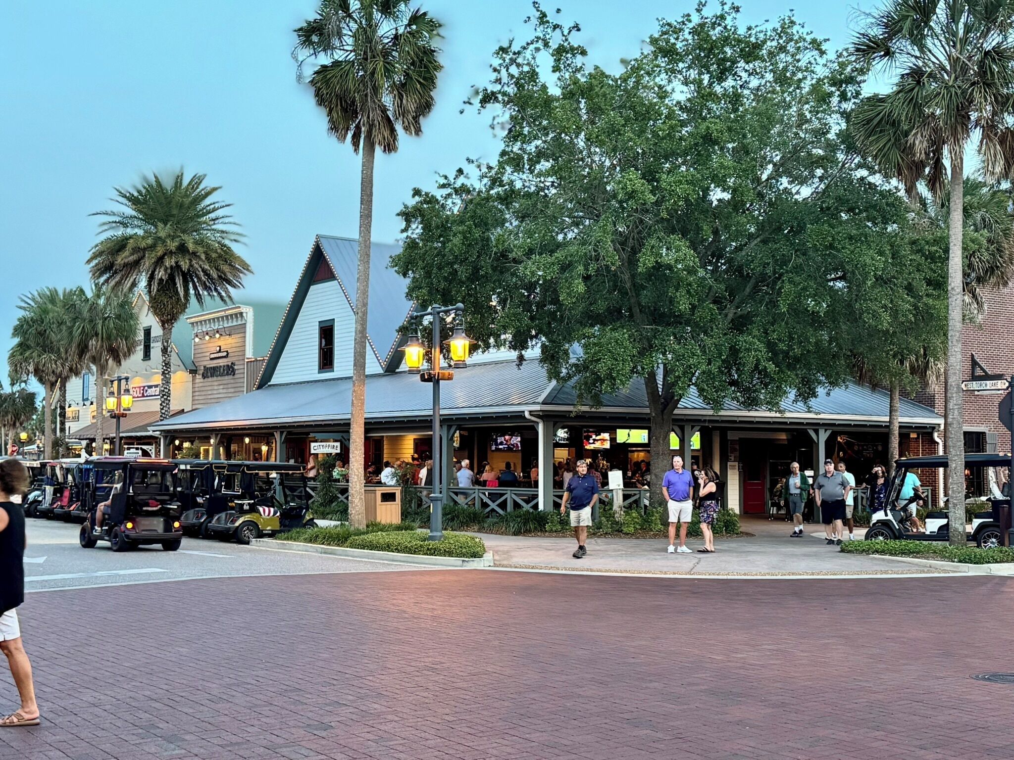 A street scene with a restaurant named "CityFire" and a golf center.