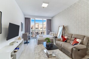 TV - bnbme | Studio in JVC Dubai | Rooftop Pool & Gym Access (Dubai)