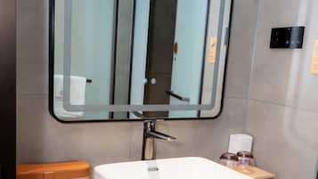 Deluxe Single Room | Bathroom | Shower, hair dryer, slippers, towels