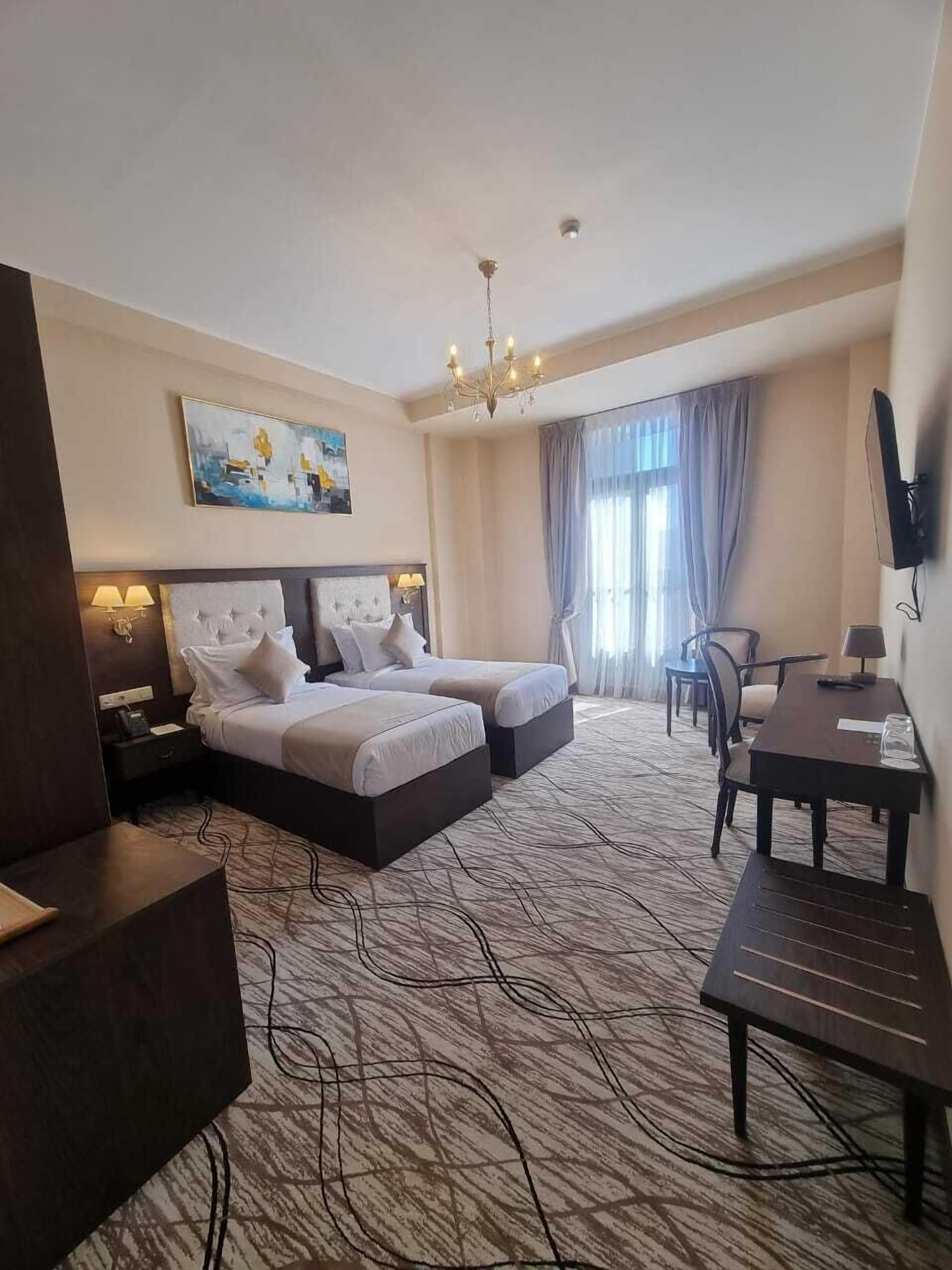 Deluxe Double or Twin Room, 1 Bedroom | In-room safe, desk, laptop workspace, blackout drapes