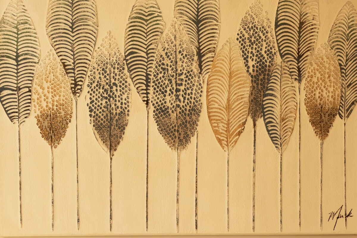 A bed with a patterned bedspread, a headboard with a green panel, and a wall with a feather-like artwork.
