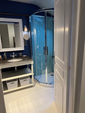 Shower, hair dryer, towels, soap