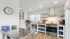 A modern kitchen with stainless steel appliances, wooden countertops, and a built-in oven. - Sedona Canyon Whisper: A 3BR retreat in Oak Creek Canyon with stunning red rock views. (Sedona)