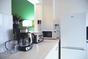 Fridge, microwave, coffee/tea maker, toaster