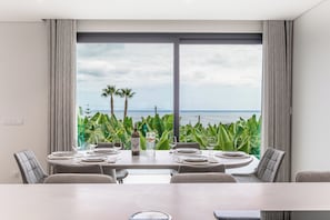 Comfort Villa, Private Pool, Sea View | Living area | 90-cm flat-screen TV with cable channels, books